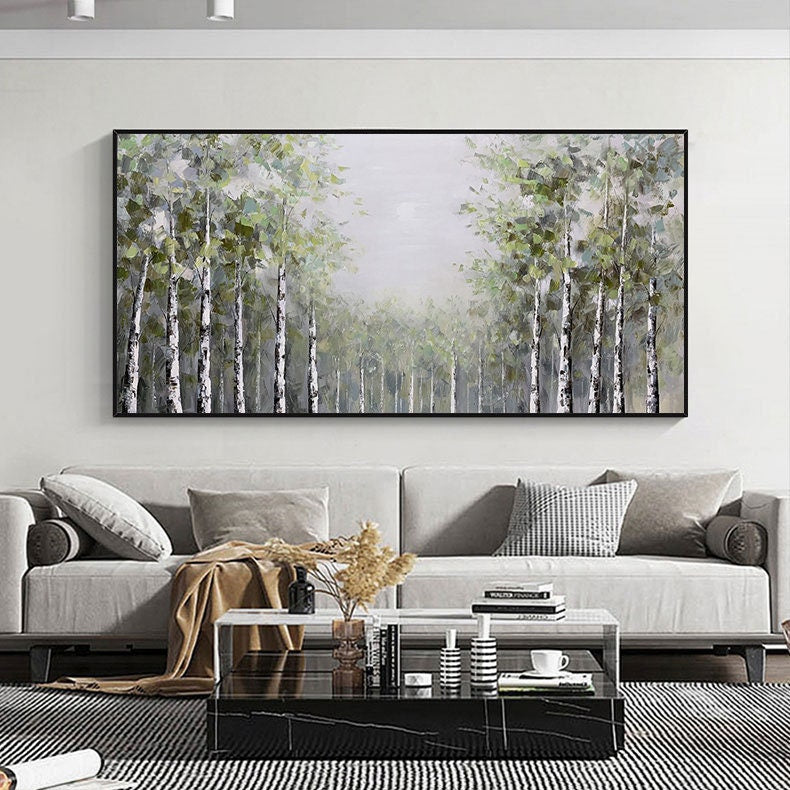 May include: A painting of a forest with tall, slender trees. The trees are painted in shades of green and white, and the background is a soft, hazy blue. The painting is framed in black.
