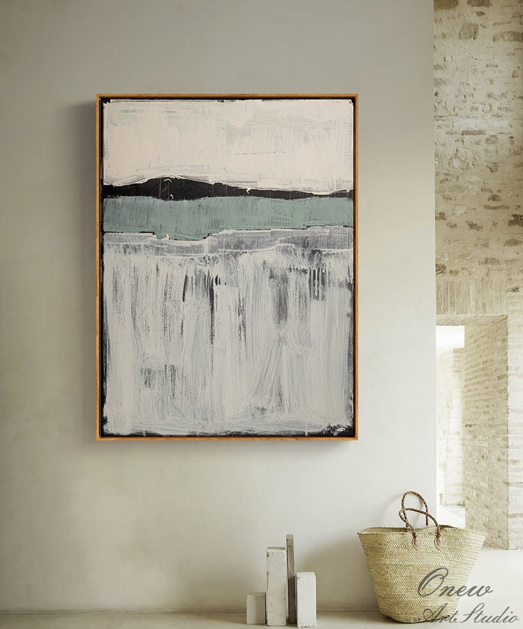 May include: Abstract painting with a white background, black and gray horizontal lines, and a light blue horizontal line. The painting is framed in a wooden frame.