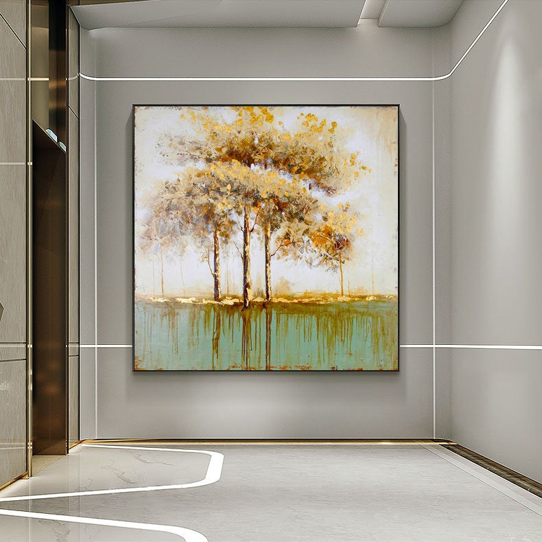 May include: A painting of a forest scene with four trees in the center of the canvas. The trees are painted in shades of yellow and brown, and the background is a light blue. The painting is framed in a black frame.