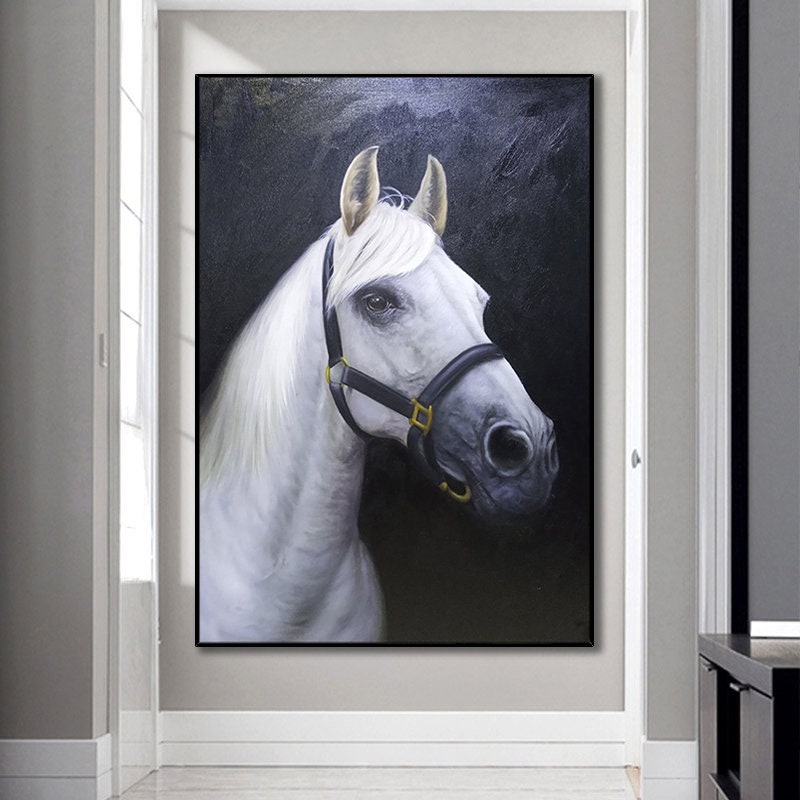May include: A close-up portrait painting of a white horse with a black bridle. The horse's head is turned to the side, and its eyes are looking directly at the viewer. The background is a dark, almost black, color.
