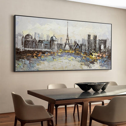 May include: A framed painting depicting a cityscape with the Eiffel Tower in the center. The painting is done in a painterly style with a mix of gray, white, and brown colors.
