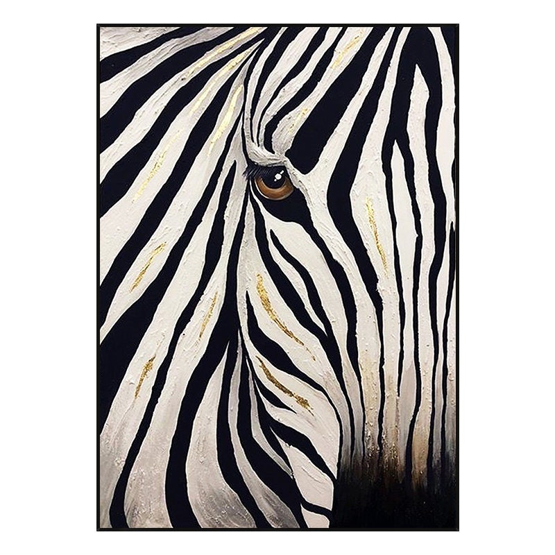 May include: Close-up of a zebra's eye and face, painted on canvas. The artwork features black and white stripes with gold accents. The zebra's eye is brown, and the painting is framed in black.
