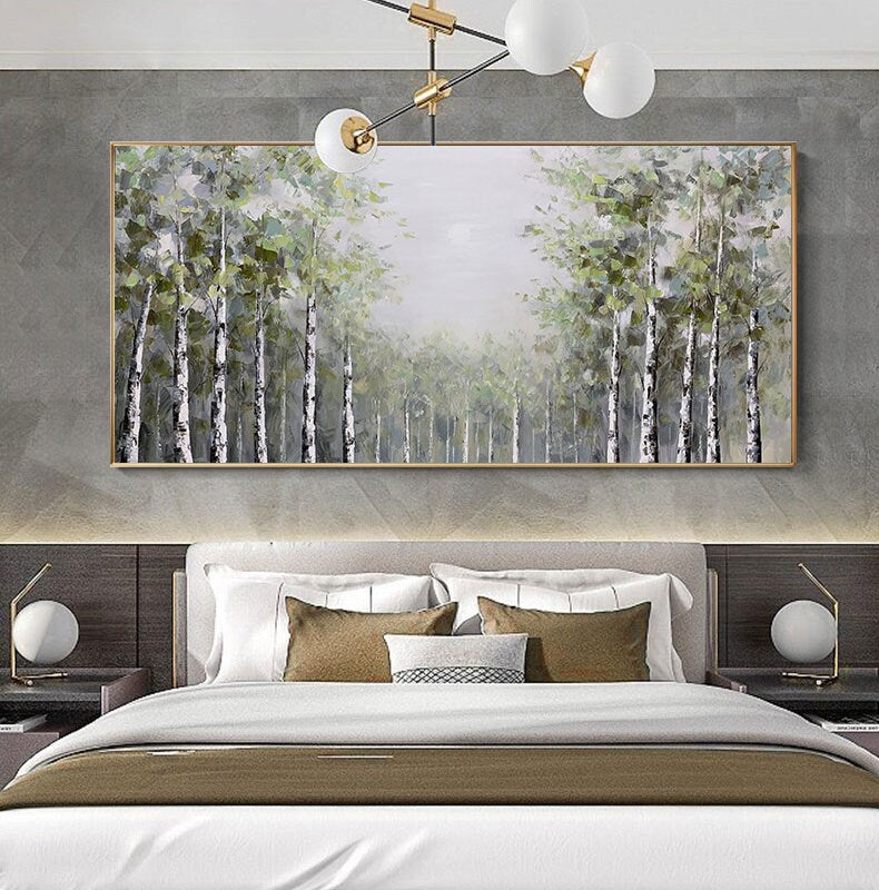 May include: A framed painting of a forest scene with a light gray background and a row of birch trees in the foreground. The trees are painted in shades of green and white, with a soft, hazy effect.