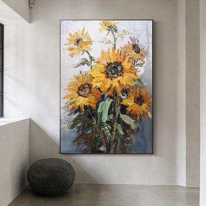 May include: A painting of a bouquet of sunflowers with yellow petals and dark brown centers. The sunflowers are painted in a textured style with visible brushstrokes. The background is a light gray with hints of blue.