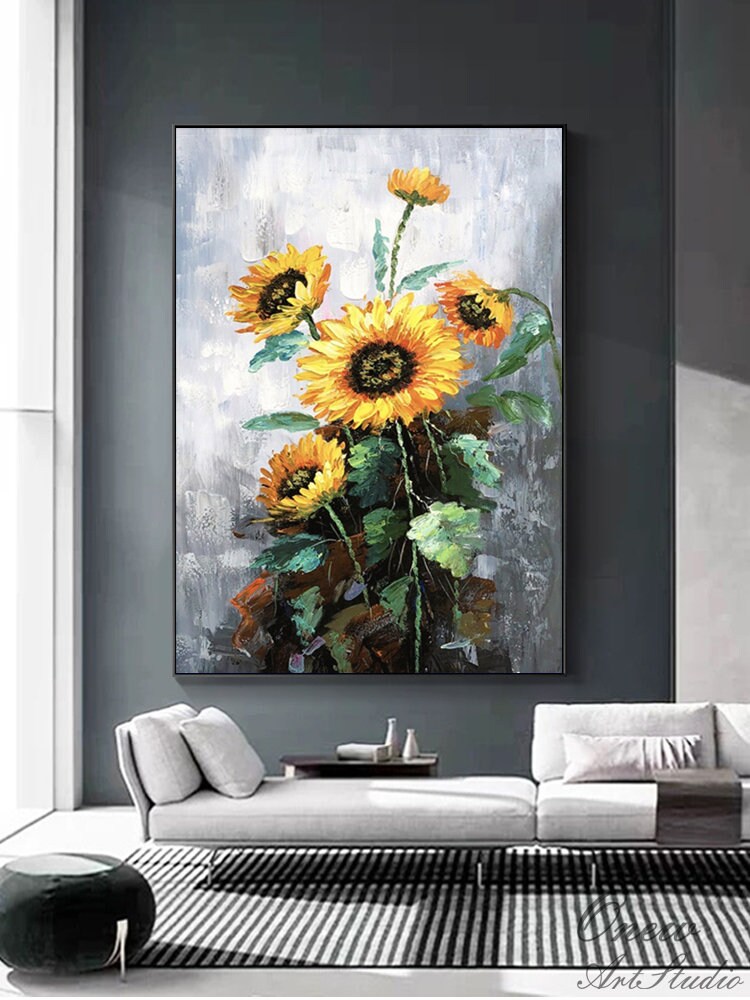 May include: A painting of a bouquet of sunflowers with yellow petals and dark brown centers. The sunflowers are painted in a realistic style with visible brushstrokes. The background is a light gray with a textured look.