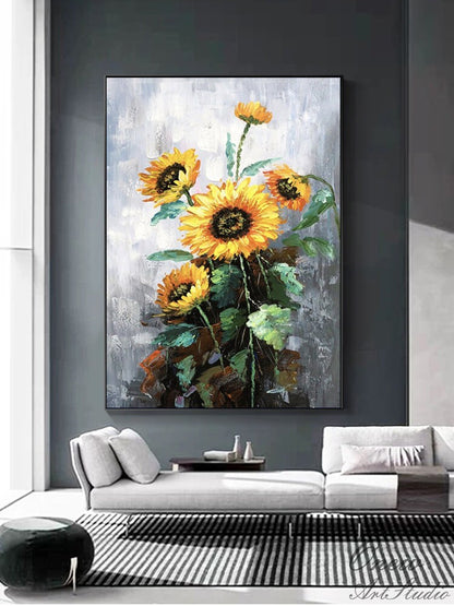 May include: A painting of a bouquet of sunflowers with yellow petals and dark brown centers. The sunflowers are painted in a realistic style with visible brushstrokes. The background is a light gray with a textured look.
