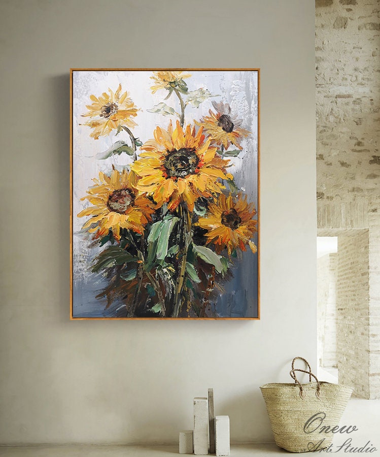 May include: A painting of a bouquet of sunflowers with yellow petals and dark brown centers. The sunflowers are painted in a realistic style with visible brushstrokes. The background is a light blue and white.