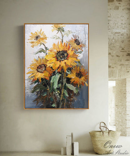 May include: A painting of a bouquet of sunflowers with yellow petals and dark brown centers. The sunflowers are painted in a realistic style with visible brushstrokes. The background is a light blue and white.