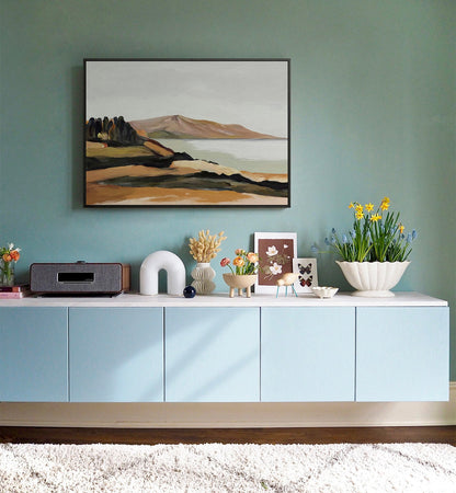 May include: A light blue cabinet with four doors sits on a white countertop. The cabinet is decorated with a painting of a landscape, a white ceramic arch, a vase with dried flowers, a vase with pink flowers, a vase with yellow flowers, and a small white ceramic sculpture of a deer.