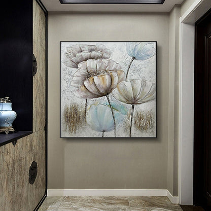 May include: A square canvas painting featuring a textured, abstract floral design. The painting depicts several large, white flowers with brown centers and blue accents. The background is a light gray with hints of brown and gold.