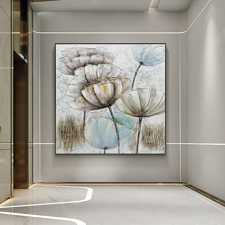 May include: A painting of abstract flowers in shades of white, brown, and blue. The flowers are painted in a textured style, giving the painting a three-dimensional look.