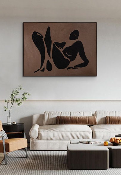May include: A black and white abstract painting of a person laying down on a brown background.