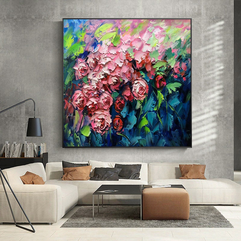 May include: A large abstract painting of pink and red roses with green leaves on a blue background. The painting is done in a thick, impasto style.