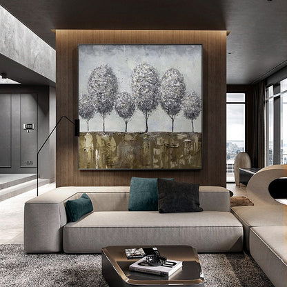 May include: A large abstract painting of a group of five trees with a textured background. The trees are painted in shades of gray and white, and the background is a mix of brown, gold, and white.