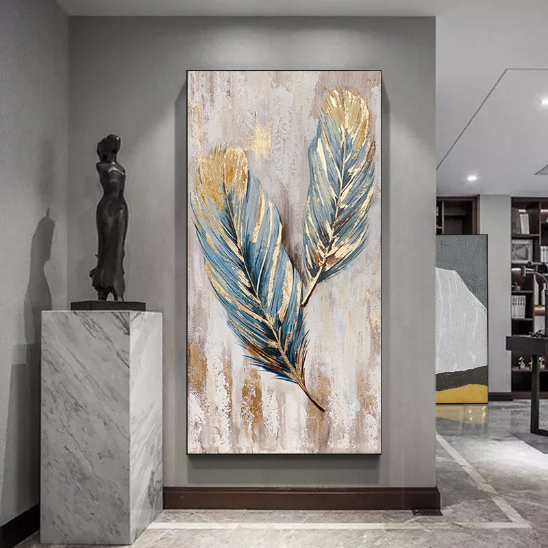 May include: Abstract painting of two blue and gold feathers on a white background.