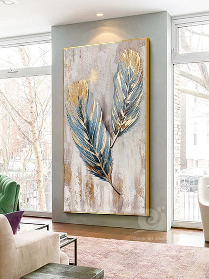 May include: A painting of two blue and gold feathers on a white background with a gold frame.