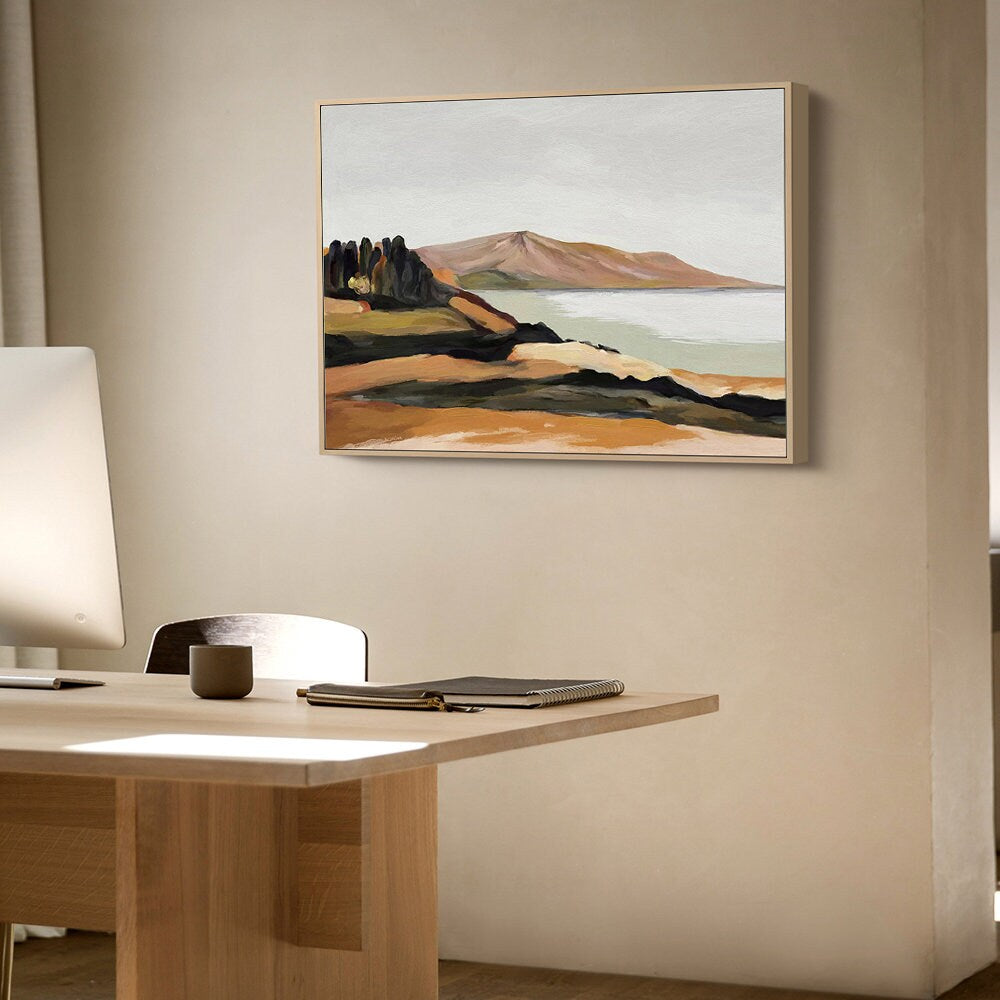 May include: A framed abstract landscape painting with a muted color palette. The painting features a mountain range, a body of water, and a small group of trees in the foreground. The colors are mostly browns, greens, and blues.