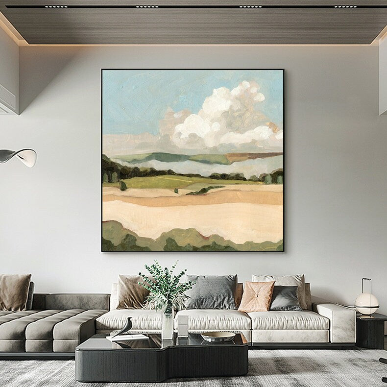 May include: A painting of a landscape with a large white cloud in the sky, green hills, and a field of brown grass.