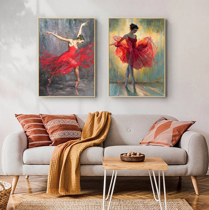 May include: Two framed paintings of a ballerina wearing a red dress. The ballerina in the left painting is in mid-pose with her arms outstretched. The ballerina in the right painting is standing with her arms at her sides. Both paintings have a light background.