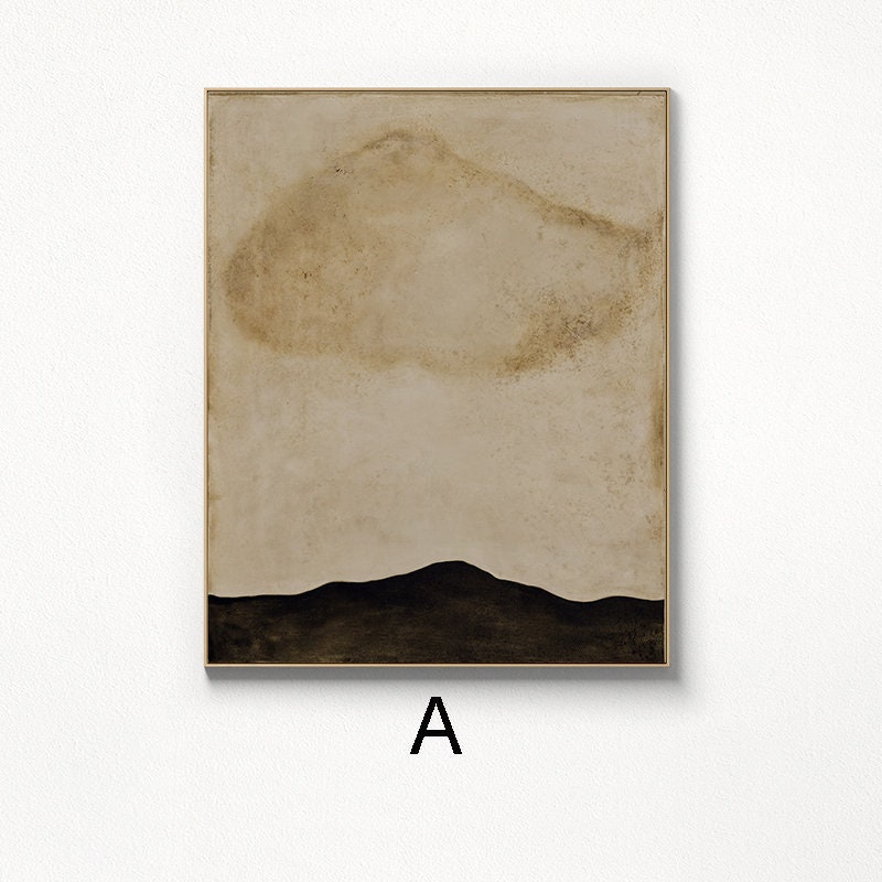 May include: Abstract art print with a brown and beige background and a black silhouette of a mountain range at the bottom. The print is framed in a gold frame.