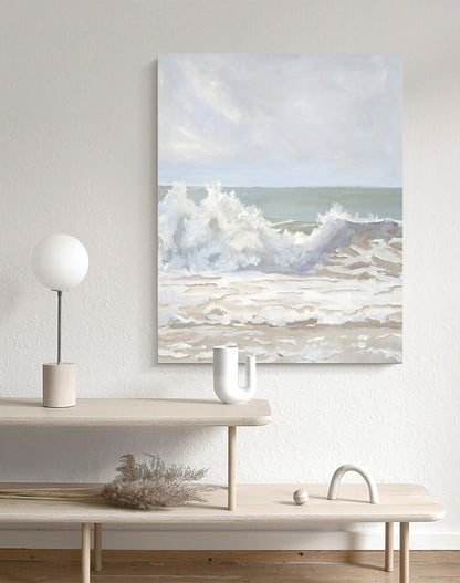 May include: A painting of a large wave crashing on a sandy beach. The sky is a light blue with white clouds. The water is a light green and the sand is a light brown.