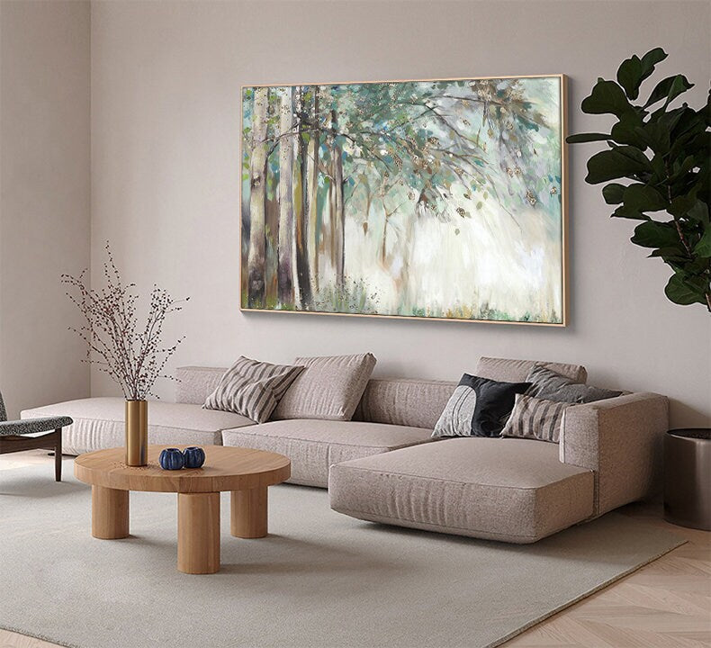 May include: A large abstract painting of a forest scene with trees and sunlight. The painting is in shades of green, brown, and white, and has a soft, dreamy feel.