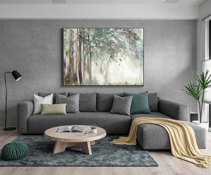 May include: A gray sectional sofa with a light beige throw blanket, a wooden coffee table, and a green throw pillow. A large abstract painting of a forest scene hangs on the wall behind the sofa.