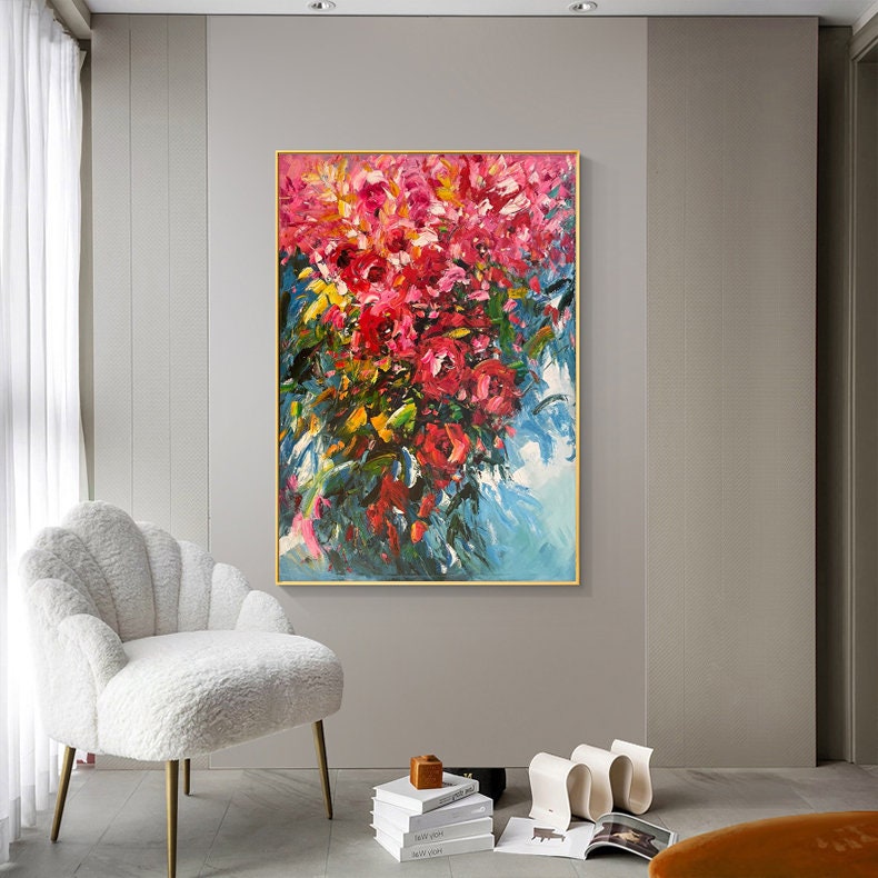 May include: Abstract painting of a bouquet of pink flowers with green leaves against a blue background.