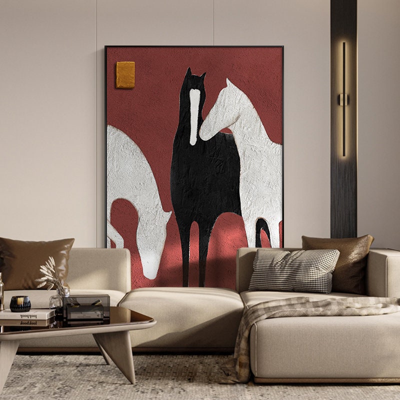 May include: Abstract painting of three horses in black and white on a red background. The horses are stylized and appear to be interacting with each other.