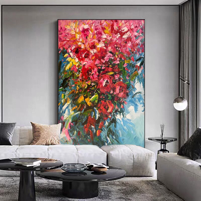 May include: Abstract painting of a bouquet of pink and red flowers with green leaves on a blue background.