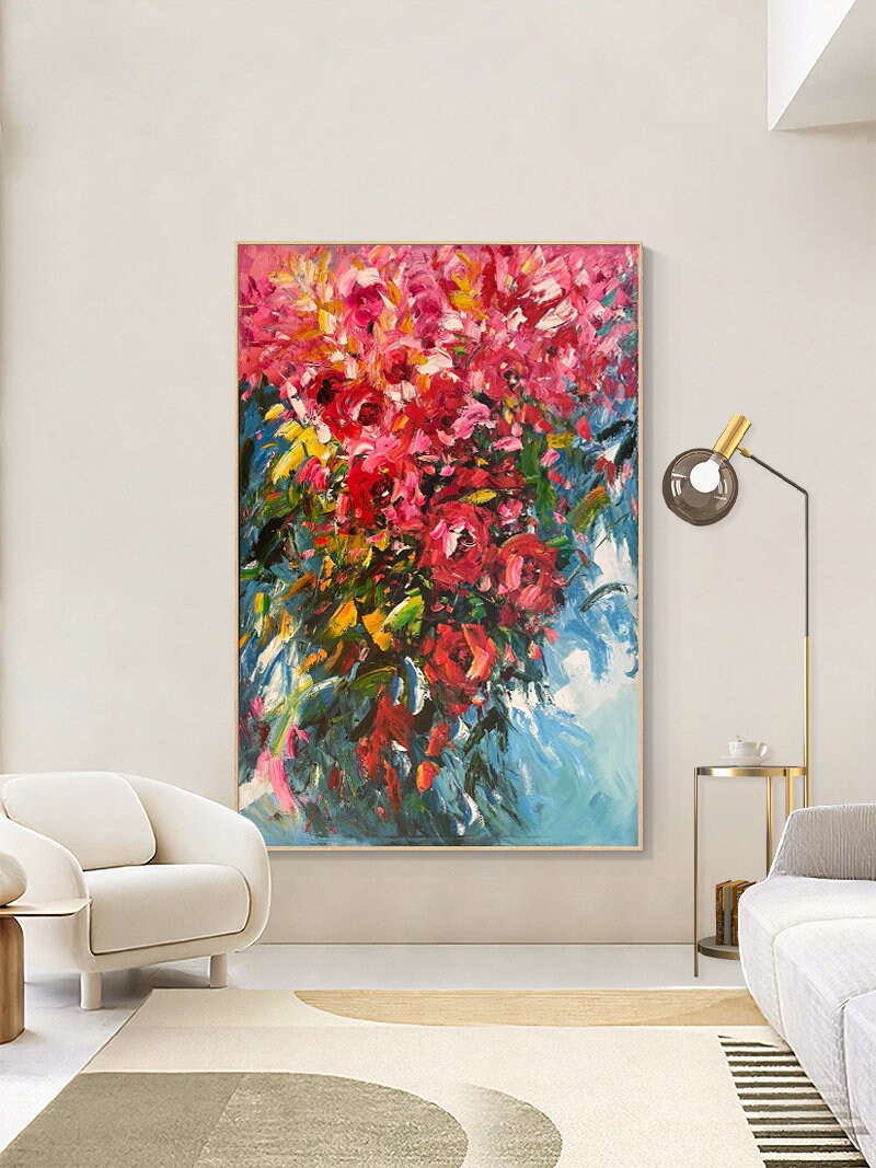 May include: Abstract painting of a bouquet of pink flowers with green leaves against a blue background.