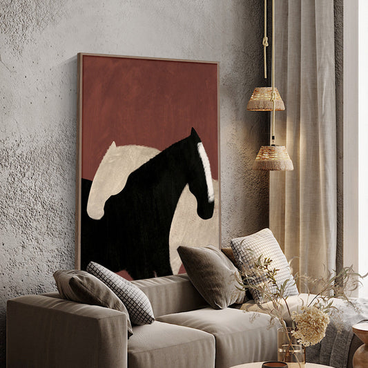 May include: Abstract painting of two horses, one black and one white, against a red background. The painting is framed and hanging on a wall in a living room setting.