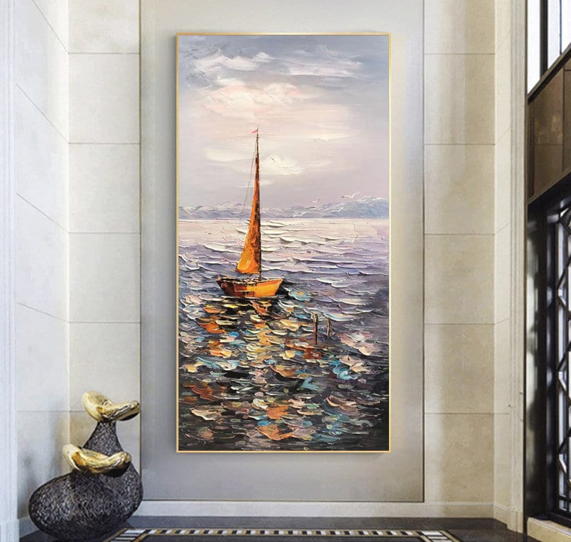 May include: A painting of a sailboat on a body of water with a cloudy sky in the background. The sailboat is orange and has a white sail. The water is a mix of blue, green, and brown colors. The sky is a light blue with white clouds.