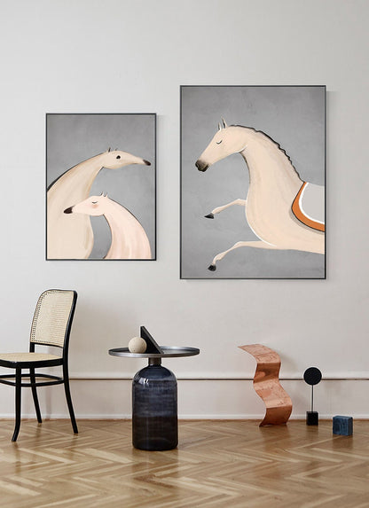 May include: Two framed illustrations of horses. The first illustration shows two horses standing next to each other, one is white and the other is light pink. The second illustration shows a single white horse jumping with its legs in the air. Both illustrations have a gray background.