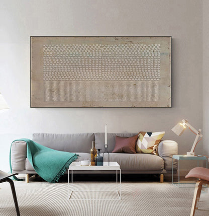 May include: A large rectangular wall art piece featuring a textured beige background with a horizontal band of raised white dots across the top half and a series of vertical white lines across the bottom half, all enclosed in a thin dark frame.
