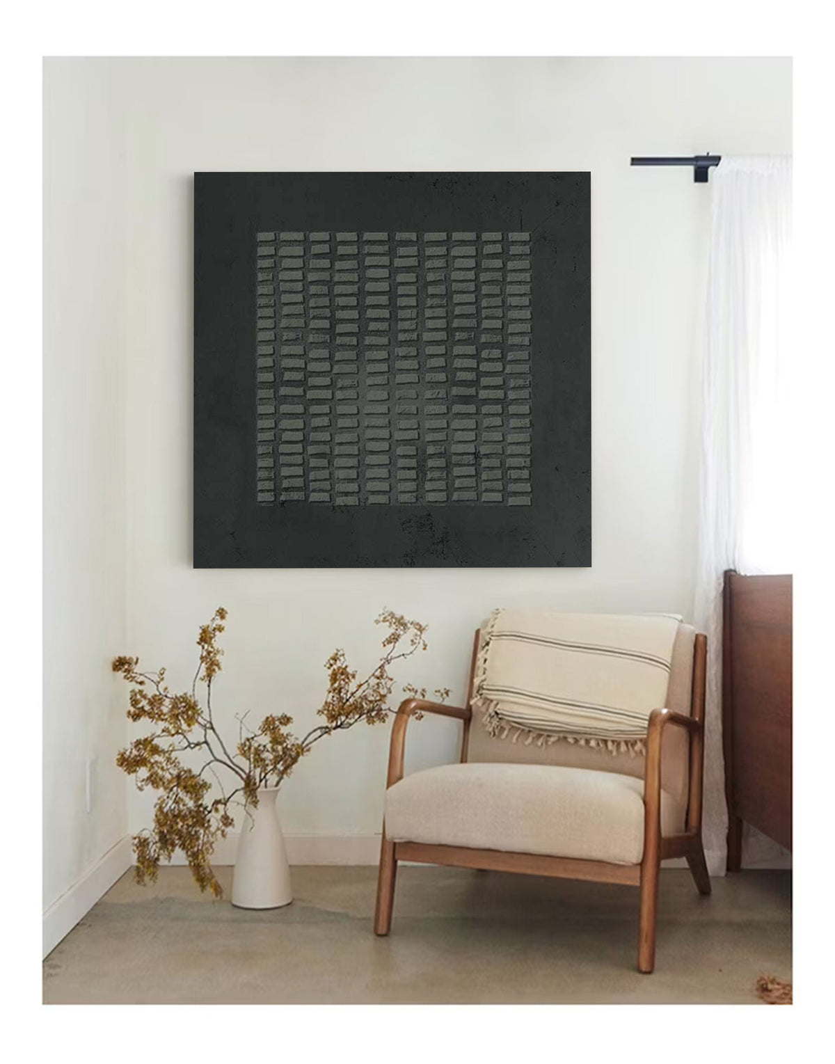 May include: A square wall art piece featuring a black background with a central grid of raised, rectangular gray textured elements. The artwork displays a matte finish and a repeating geometric pattern, creating a tactile surface appearance.