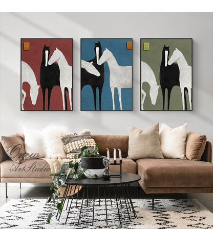 May include: Three framed abstract paintings of horses in black, white, and grey. The horses are in a stylized, minimalist style. The paintings are on a red, blue, and green background.
