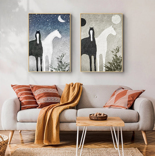 May include: Two abstract paintings of black and white horses standing side by side against a textured background. One painting has a blue background with stars and a crescent moon, while the other has a gray background with a full moon.