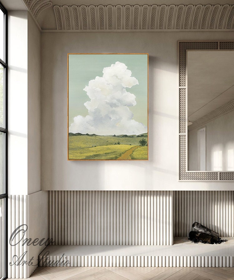 May include: A painting of a landscape with a large white cloud in the sky. The landscape is green and yellow with a dirt road leading through it.