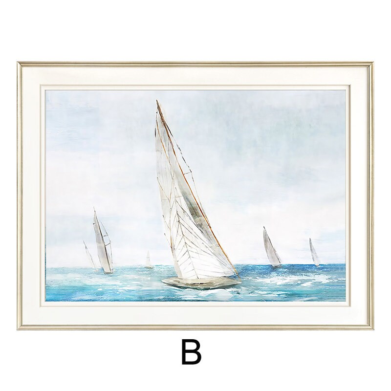 May include: A framed watercolor painting of sailboats on a blue ocean with a light blue sky. The sailboats are white and have a light brown mast. The painting is framed in a light gold frame.
