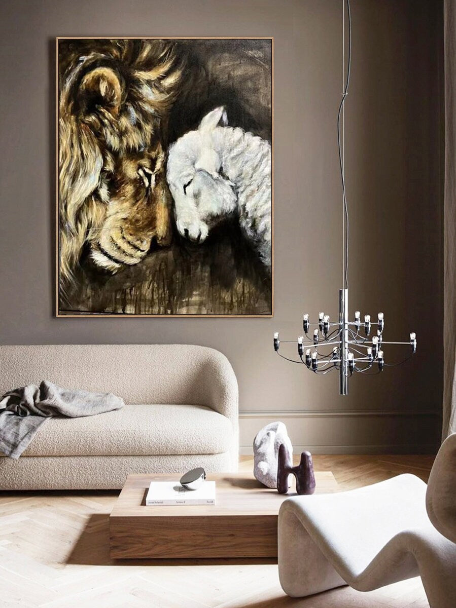 May include: A painting of a lion and a lamb with their heads touching. The lion is brown and gold, and the lamb is white. The background is dark brown.