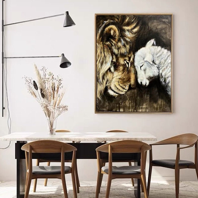 May include: A painting of a lion and a lamb with their heads touching. The lion is brown and has a mane. The lamb is white. The background is dark brown.