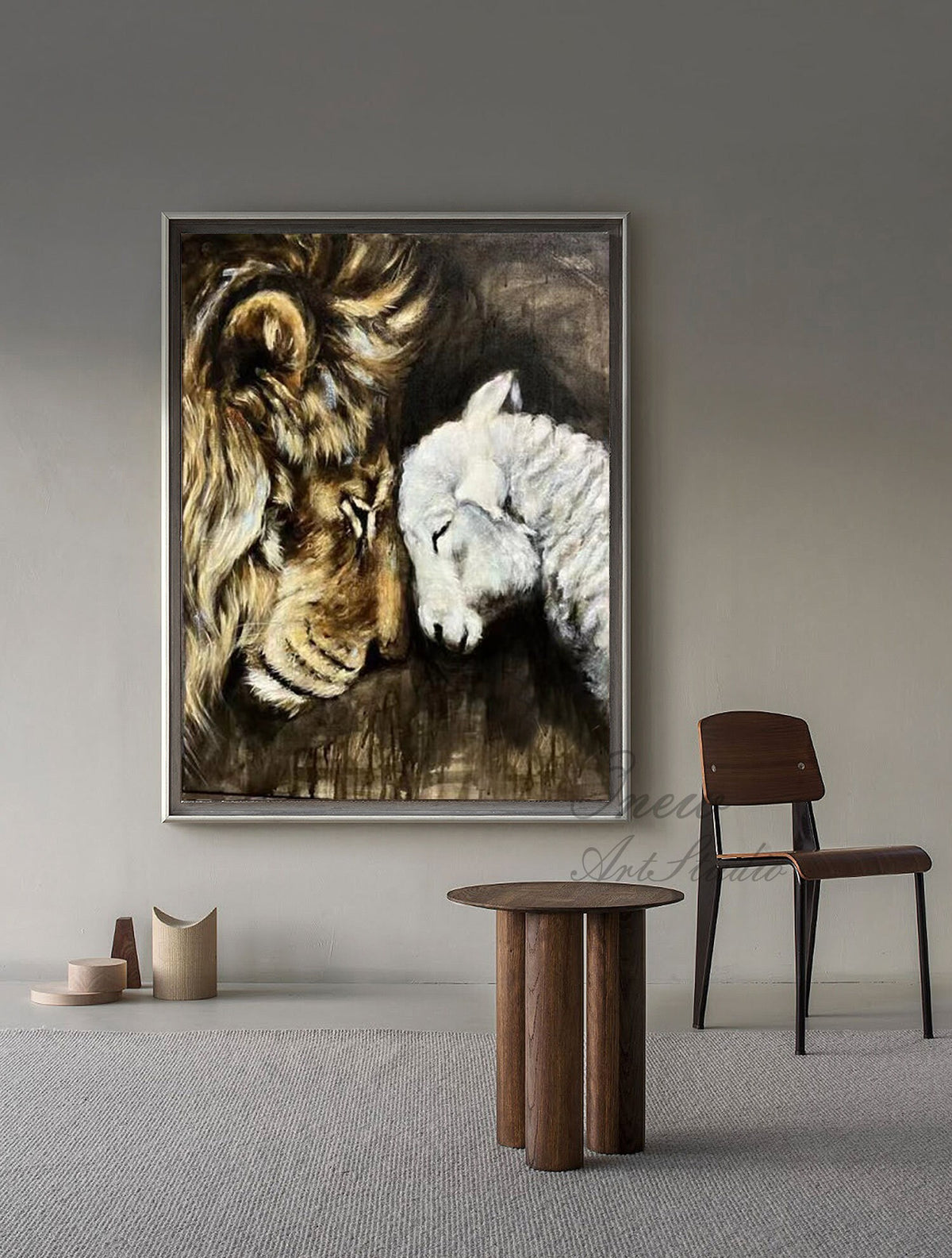 May include: A painting of a lion and a lamb resting their heads together. The lion is brown and has a mane. The lamb is white. The painting is in a silver frame.