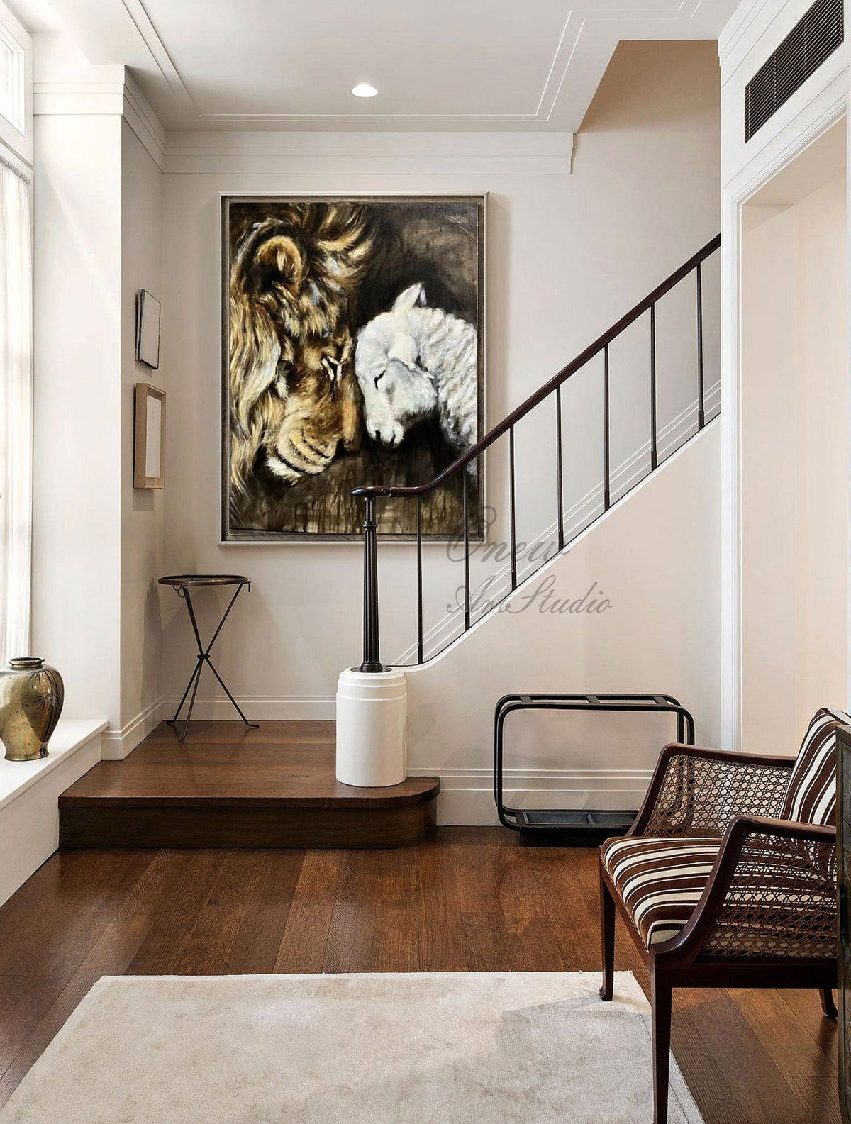 May include: A painting of a lion and a lamb with their heads touching. The lion is brown and has a mane. The lamb is white. The painting is on a canvas and is framed. The painting is hanging on a wall in a home.