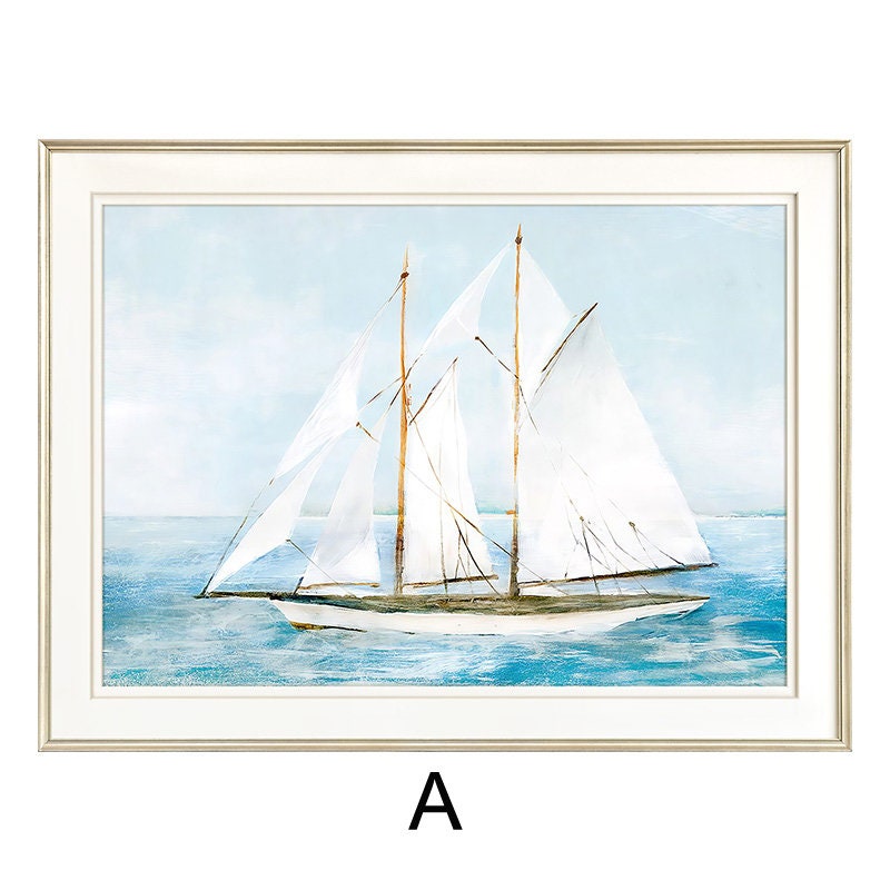May include: A framed watercolor painting of a sailboat with white sails on a blue ocean. The painting is in a light wood frame with a white mat.
