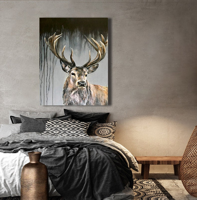 May include: A painting of a stag with large antlers, set against a dark background with white and gray brushstrokes. The stag is looking directly at the viewer.