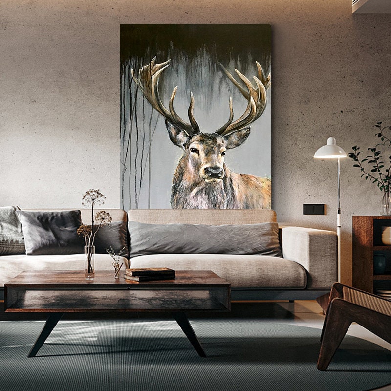May include: A painting of a large, brown deer with antlers standing in a forest. The deer is looking directly at the viewer. The background is a dark gray with streaks of black paint.