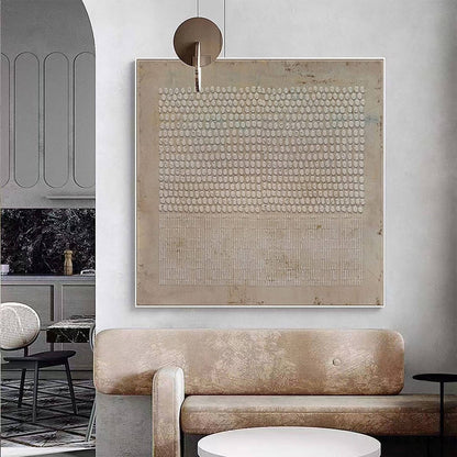 May include: Abstract art print with a beige background and a pattern of small white circles and lines. The print is framed and hanging on a wall.