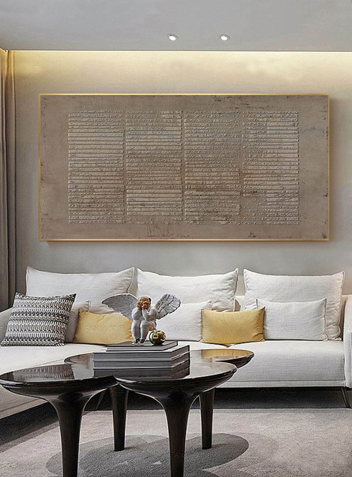 May include: A modern living room interior with a white sofa, two coffee tables, and a decorative angel figurine. A large abstract painting with a textured, gray and brown color scheme hangs on the wall above the sofa.
