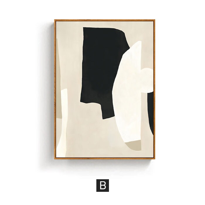 May include: Abstract art print with black, white, and beige shapes on a beige background. The print is framed in a light wood frame.
